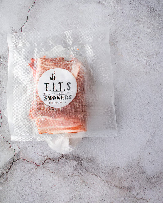 Vacuum Packed Slicked Streaky smoked bacon by This.Is.The.Shit aka. 'T.I.T.S Smokery'. Smokey goodness delicious and dish enhancing.